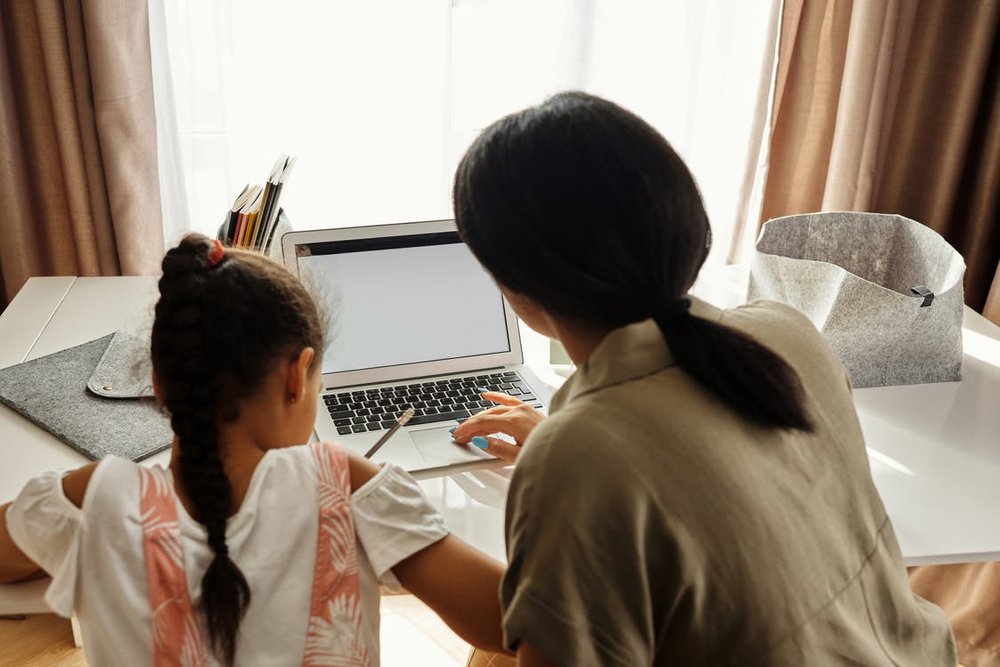Mother-helping-her-daughter-with-homework_png_85