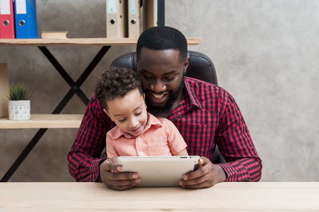 father-son-using-tablet-table_png_85